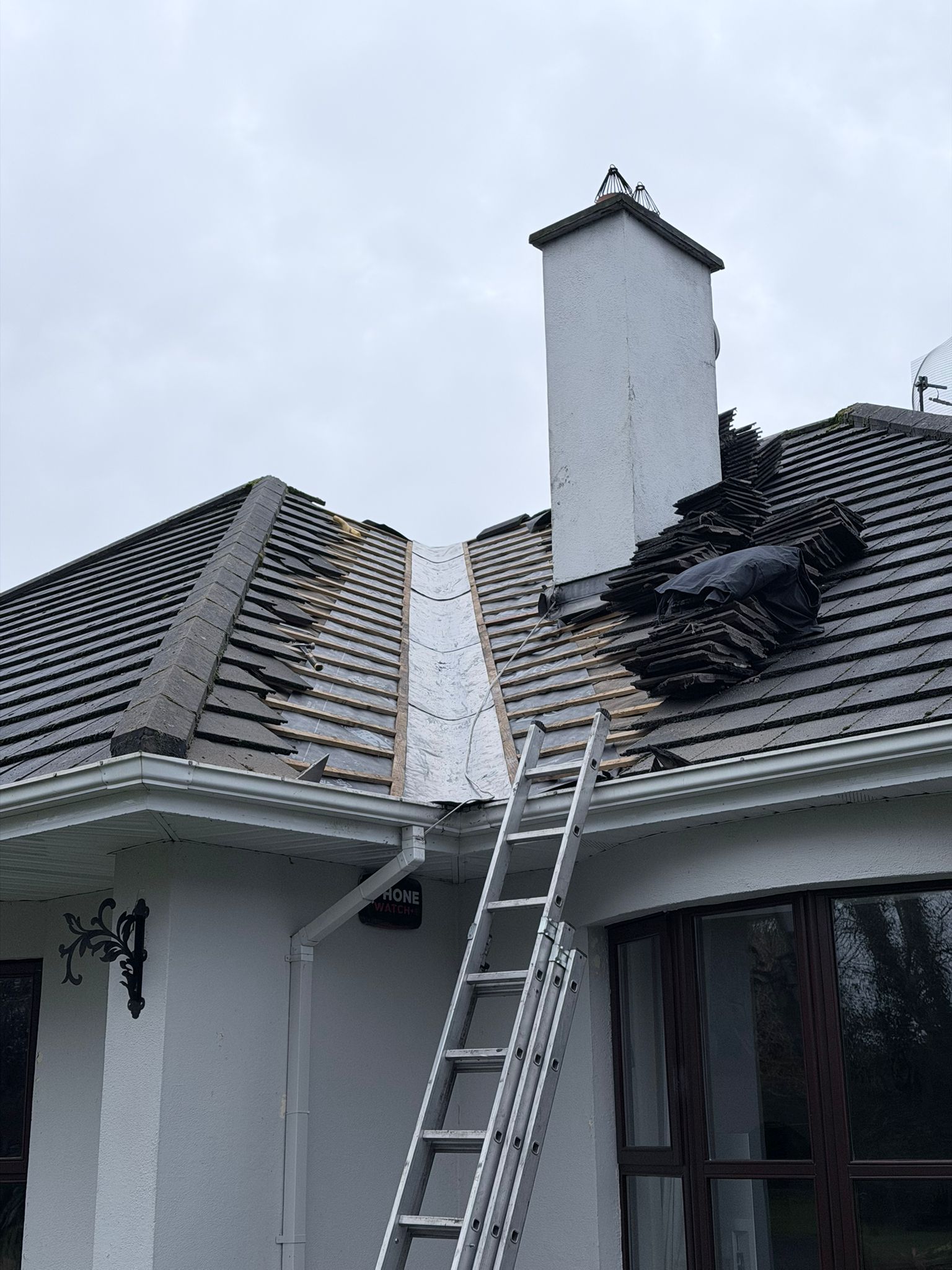 Satisfied homeowners with professional roof installation Ireland